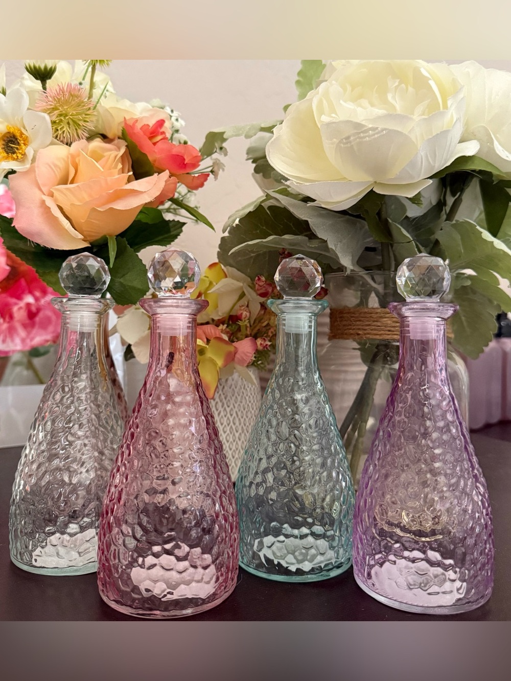 🪷 HAMMERED STYLE SET OF 4 DECORATIVE GLASS BOTTLES. BRAND NEW! COMPLETE SET!